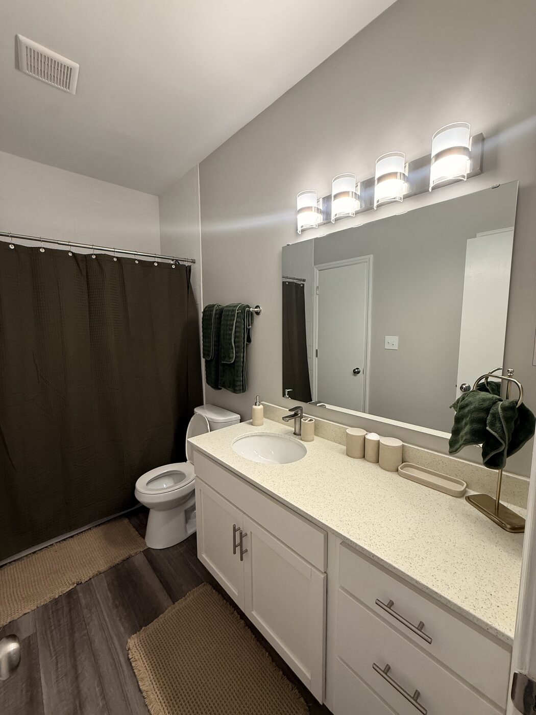 Bathroom vanity with mirror and towels
