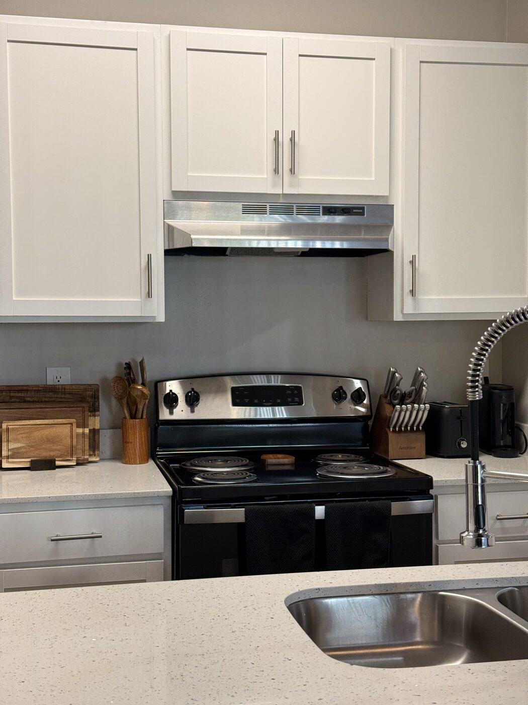Stove, cutting boards, knife block, and coffee maker