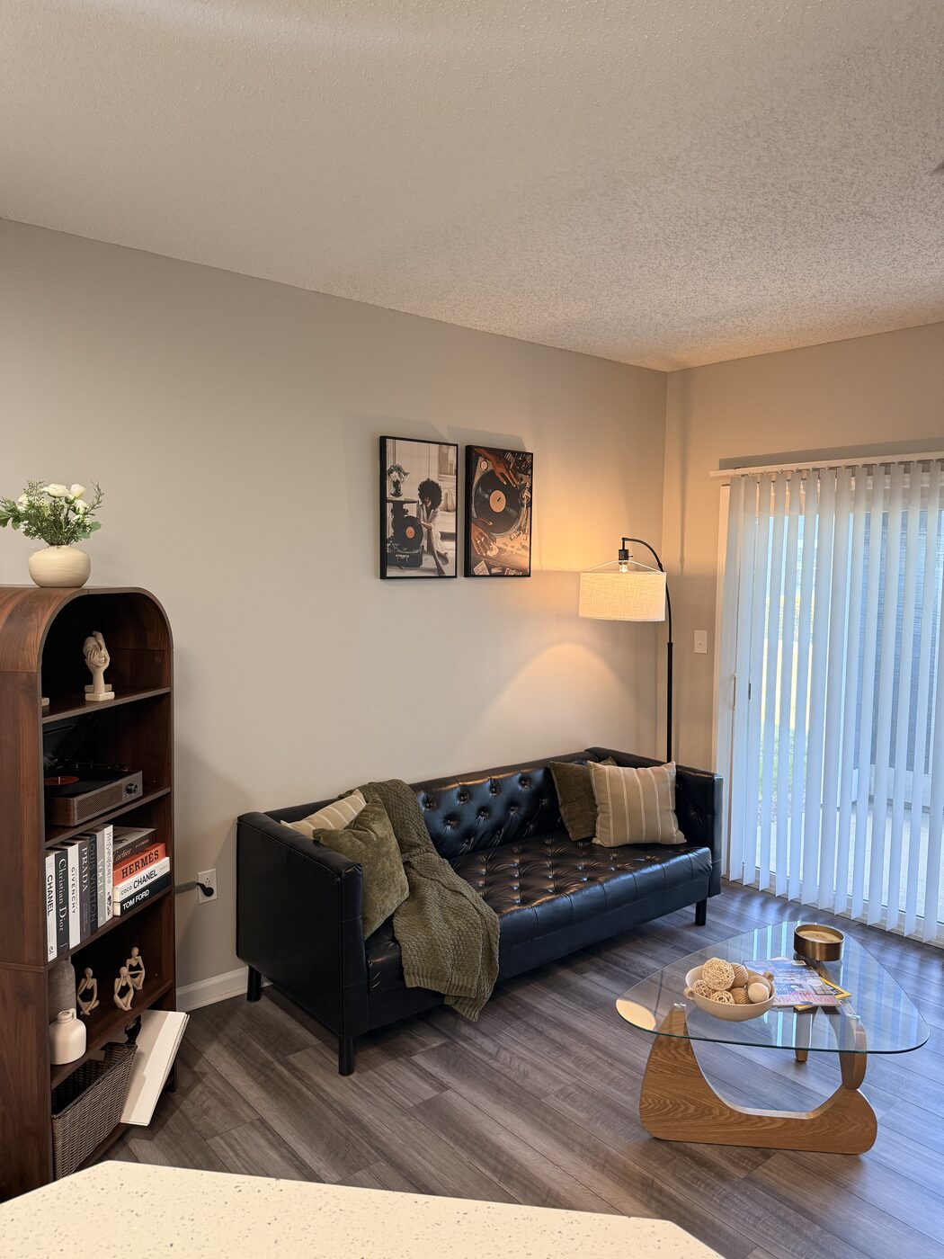Leather sofa with record-themed wall art